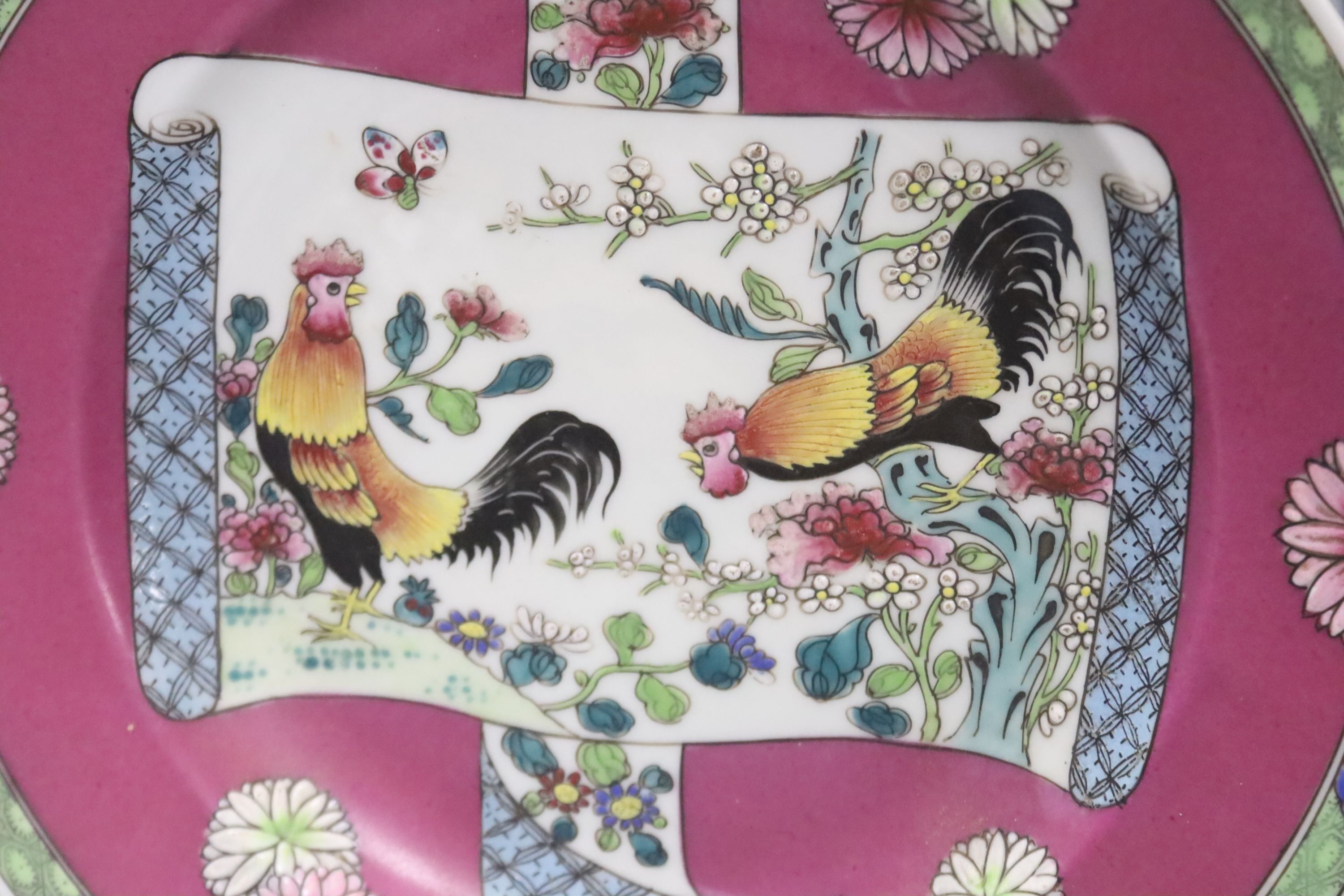 A pair of Chinese famille rose cockerel plates, diameter 24cm